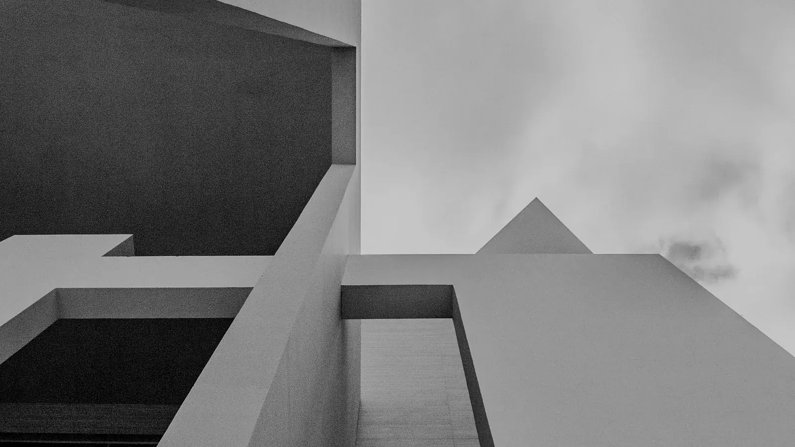 Clean white volumes meeting an overcast sky — green bonds securitization