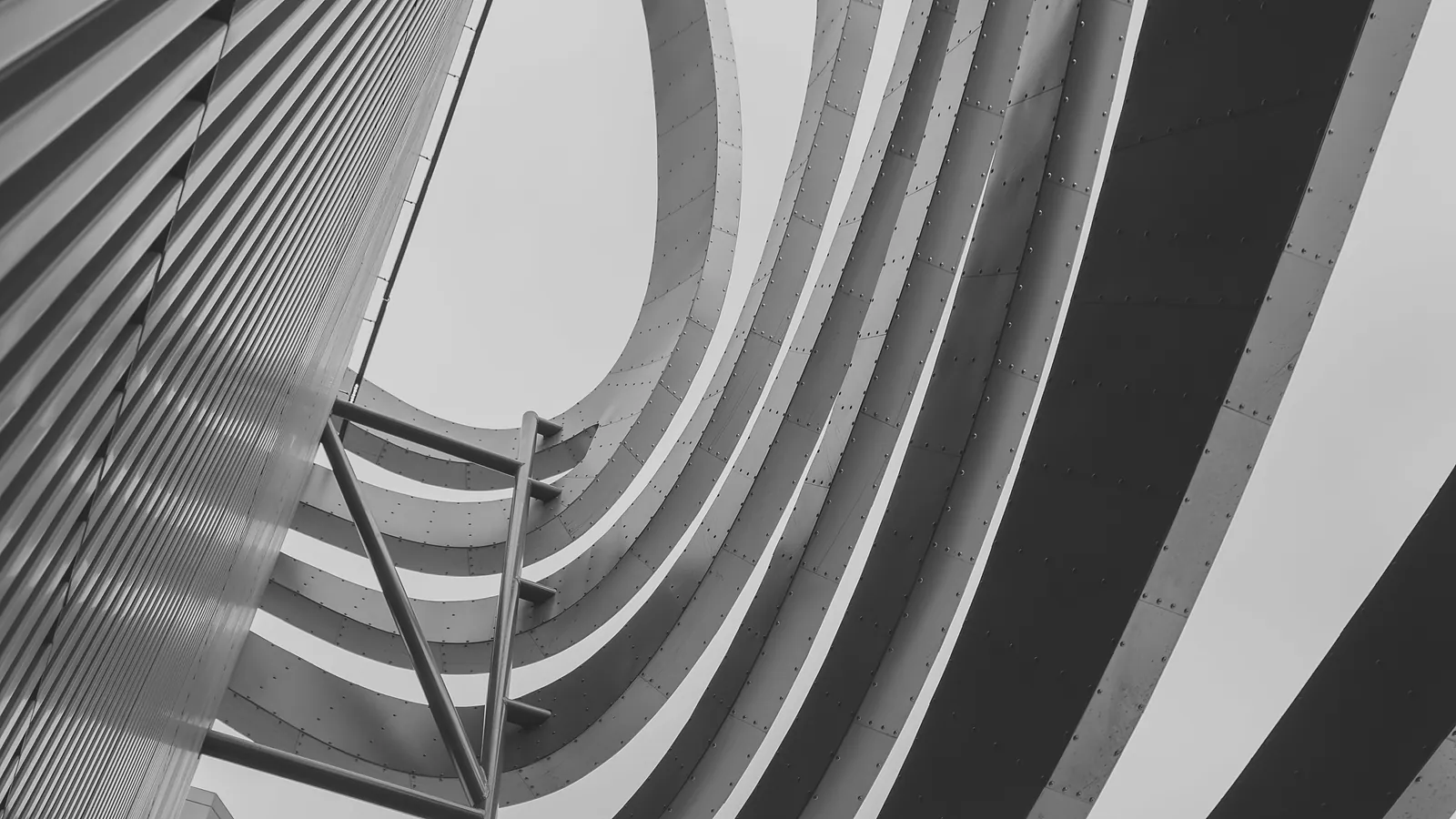 Future Cash Flow Securitization 1 Riveted metal ribs curving in sequence — future cash flow securitization